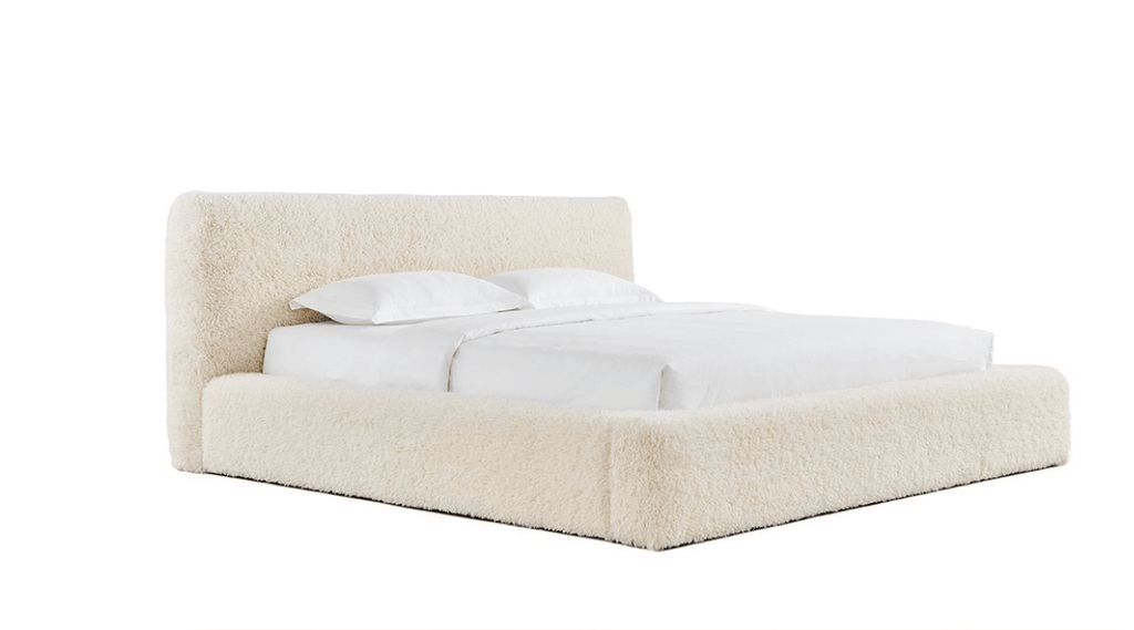 Queen-size Teagan Sherpa Bed with faux sheepskin upholstery in a cozy, styled bedroom setting by HomebyBE.